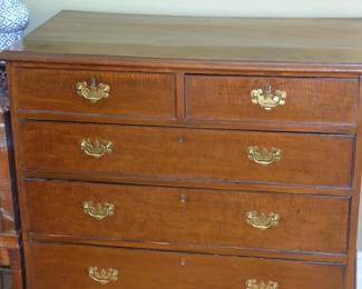 Closeup of 5-drawer wooden bedroom dresser
