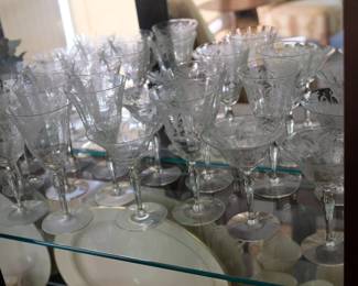 Fine selection of delicately etched glass wine and cordial glasses