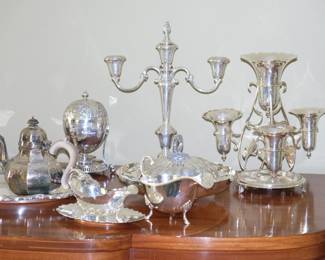 More from the wide variety of silver and silver plate items including antique Victorian egg coddler, teapots, creamers, centerpieces, candlesticks, gravy boats, trays and covered serving dishes