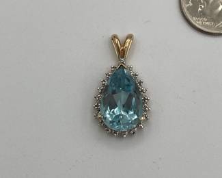 A 10k gold and topaz pendant