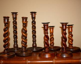  Multiple pairs of antique carved oak barley twist candlesticks