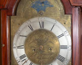 Closeup of mahogany longcase clock, likely 18th/19th Century