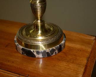 Closeup of vintage brass candlestick shaded lamp on marble base