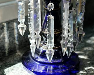 Close up of the clear glass pendant spears on the late 19th century antique English Victorian blue glass mantle luster