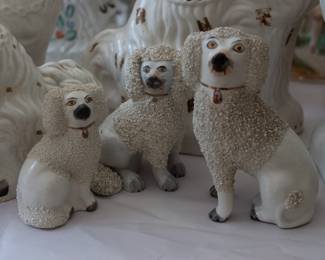 Closeup of some of the antique porcelain Staffordshire dog figurines 