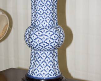 Closeup of vintage Chinese porcelain vase lamp, shade, wooden carved base