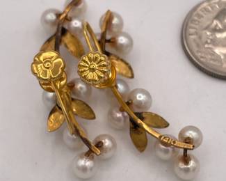 Closeup of 14k gold and cultured pearl screwback earrings