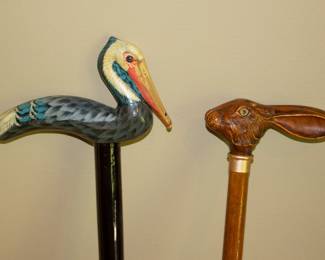 Closeup of walking sticks - pelican and rabbit
