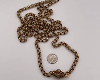 Another view of 19th Century pinchbeck guard chain / necklace with round oval links and an elaborate barrel clasp with cannetille embellishment and set with amethysts