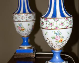 Closeup of beautiful pair of urn shape porcelain enameled lamps, made in France