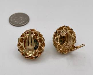 Backs of pair of 14k gold and turquoise clip earrings