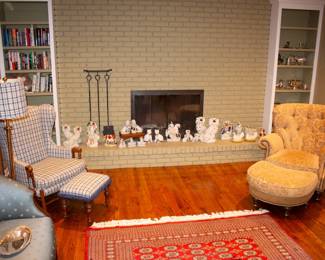 Part of the Staffordshire figurine collection, vintage wingback arm chair with matching ottoman and standing lamp, another gold-toned upholstered arm chair with matching ottoman, books, rugs, silver plate trays, bowls, teapots, and more