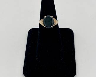 14k gold ring with large very dark sapphire and small side diamonds