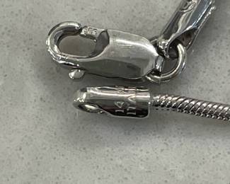 Closeup of clasp on 14k white gold serpentine necklace with 5 pendant diamond spacers, made in Italy