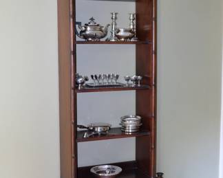 Polished wood open shelving display case with drawer base