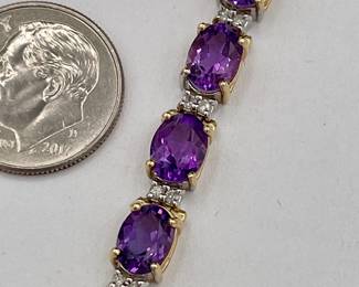 Closeup of 14k gold amethyst and diamond bracelet