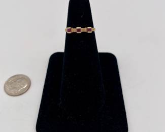 14k gold ring with three square rubies, artist's stamp inside