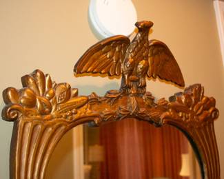 Closeup of Federalist-style gilt-gesso mirror with cornucopia eagle crest