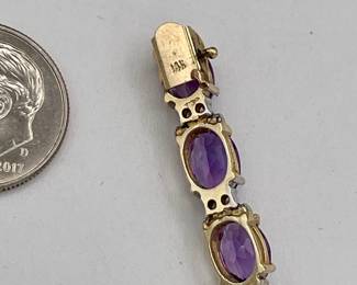 Closeup of 14k gold amethyst and diamond bracelet