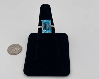 14k gold ring, large topaz, emerald cut, with two diamonds