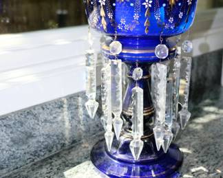  Late 19th Century antique English Victorian blue glass mantle luster, waisted column rising from round base, beautifully decorated with enameling and gilding, crenellated top and with a double row of seven well cut clear glass pendant spears