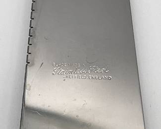 Closeup of Sheffield England stainless steel cake knife, enameled porcelain handle