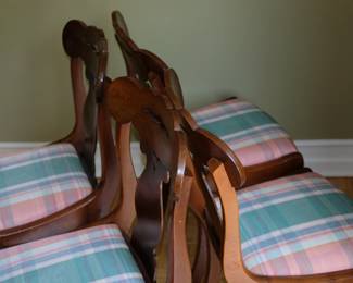 Closeup of matched set of four vintage wooden chairs