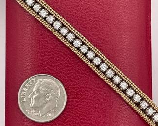 Closeup of 14k gold and diamond tennis bracelet