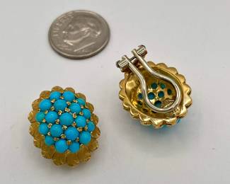 Closeup of 18k gold and turquoise clip earrings, made in Italy