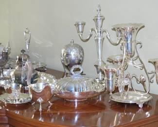 Another view of  the wide variety of silver and silver plate items including Victorian egg coddler, teapots, creamers, centerpieces, candlesticks, gravy boats, trays and covered serving dishes