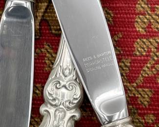 Closeup of the set of Reed & Barton Mirrorstele Francis I pattern sterling silver handle flatware