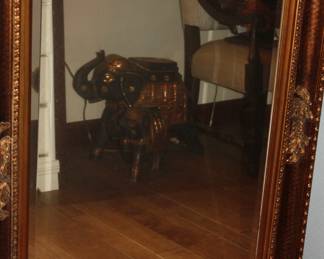 Large beveled mirror in ornate frame