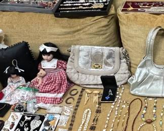 Assorted bags jewelry & dolls