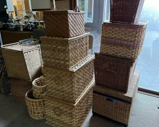 stacks of vintage wicker trunks and baskets