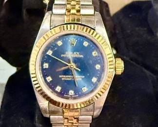 2002 Ladies Rolex watch with cobalt face and diamond numerals