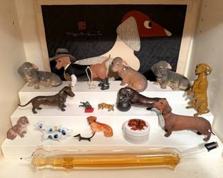 Dachshund collection!  Miniatures, bronzes, Royal Copenhagen and so many more!  There are 18k Dachshund brooches in the jewelry collection.  They are amazing!