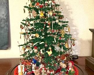 Hand beaded Christmas tree with ornaments under a glass dome.  We also have a “kit” in the seasonal area to create your own.  This tree is truly special!