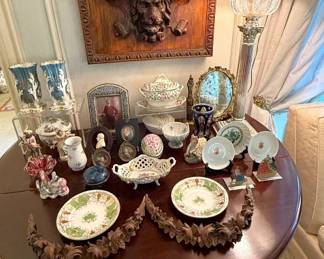  French and English porcelains and carvings on a drop-leaf Demi-lune table