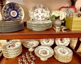 Bottom shelf:  19th Century Rockingham hand painted china with floral motif 