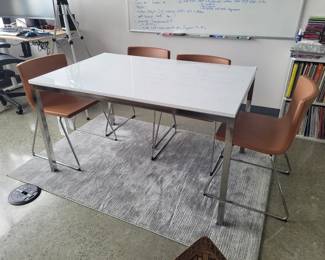 White and chrome table with 4 leather chairs