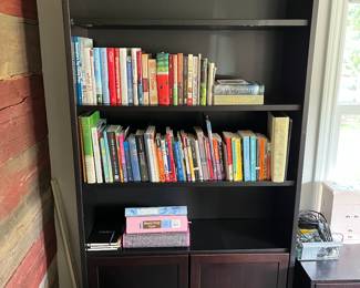 Wood bookshelf; books.