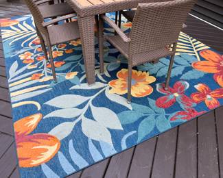 Indoor/outdoor area rug by Veranda, 9’, 10’ x 7’, 10”.
* Table and chairs not for sale.