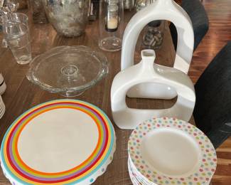 Two Torre & Tagus white ceramic vases; set of 12 Rosanna plates; colorful cake stand by Design Design.