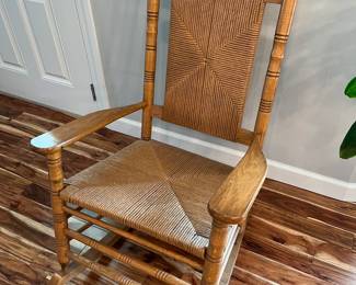 Oak rocking chair with rush seat and back.