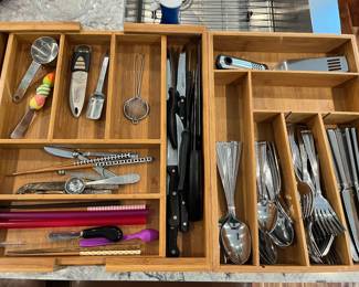 Selection of flatware, knives and cooking utensils.