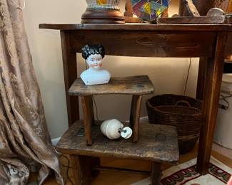 Antique stools, porcelain doll head