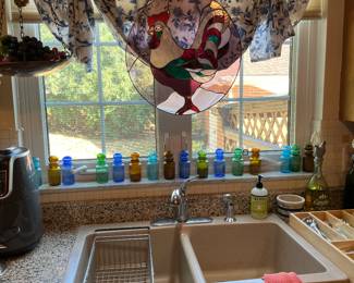 Stained glass and colorful glass bottles