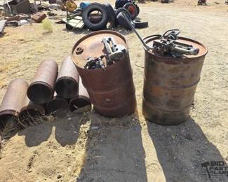 4222  2 55 Gal Drums with Pumps and 6 10 Metal Pipes 
