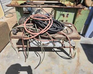 1040  Air Hose, Electric Wire, Grinder and Metal Table with Wooden Top 