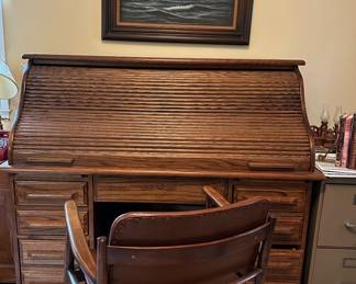 Antique roll top desk and antique swivel chair